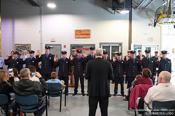 swearing in 11 new Firefighters