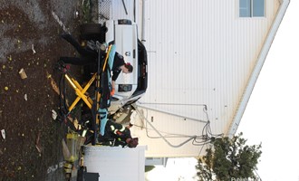 Pickup Truck into House