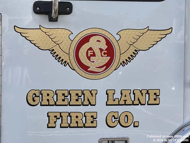 The Green Lane Fire Company emblem features a gold winged design surrounding the company