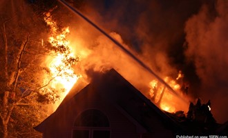 Selden fd battles heavy fire through the roof