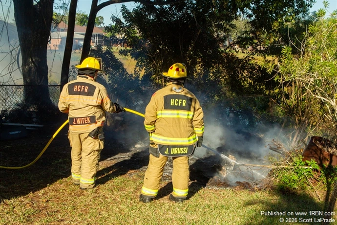 Firefighters from Quint 1 wet down the area of where the fire began.