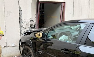 Remarkable Escape: Two Injured After Vehicle Traverses Route 5 and Slams into Commercial Structure