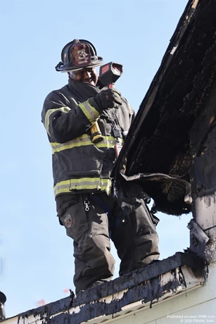 Camden FF Mike Williams uses the TIC to aid with overhaul at this working fire at 108 Cooper Avenue, Woodlynne, NJ on October 28, 2026.
