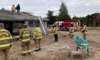 Firefighters Conduct Ventilation Drill on Acquired Structure