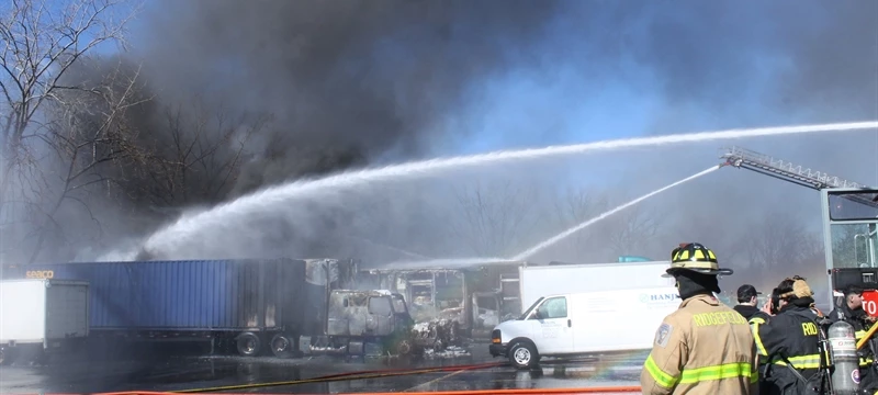 Multiple trucks burn in mid-day fire in Ridgefield.