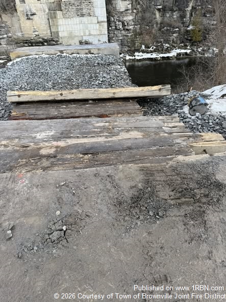 Excavator Overturns Into Black River in Brownville