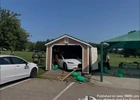 Not Quite the Parking Spot: Car Ends Up Inside Storage Shed